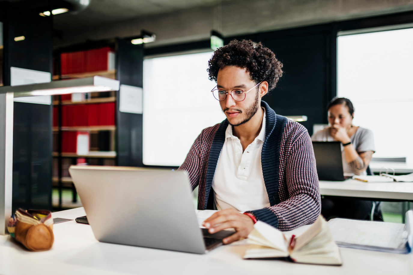 Man using laptop in business setting