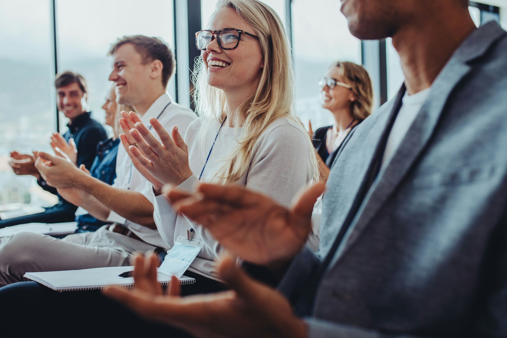 Professionals attending a panel discussion about balancing the risks and rewards of AI