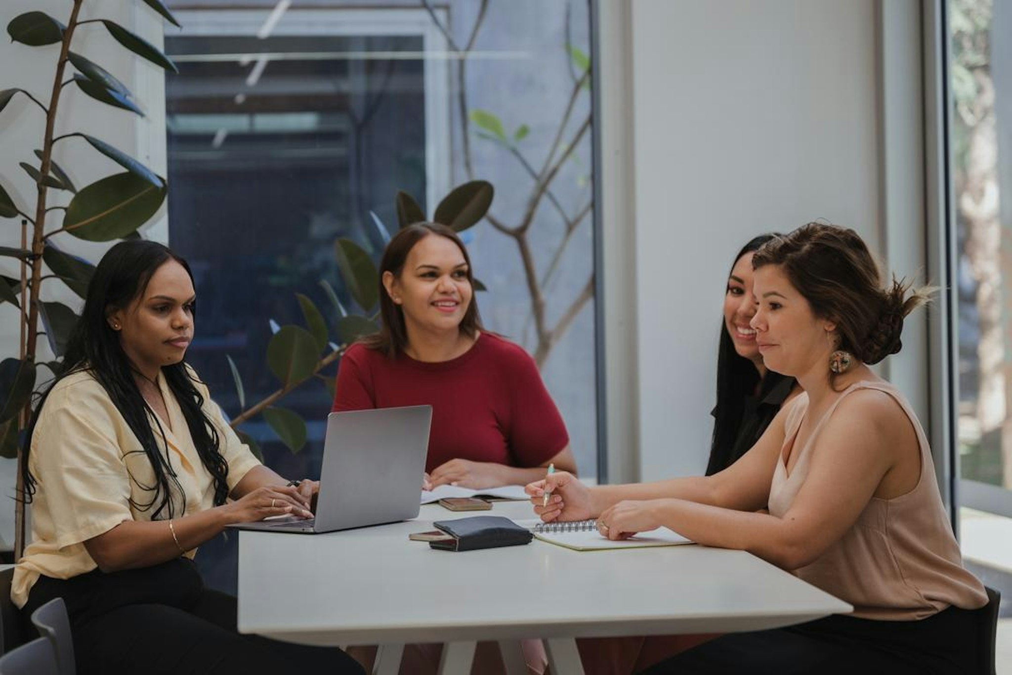 A corporate secretary taking meeting minutes