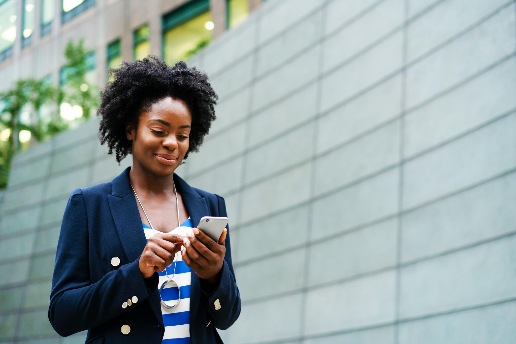 Business professional using AI on a smartphone