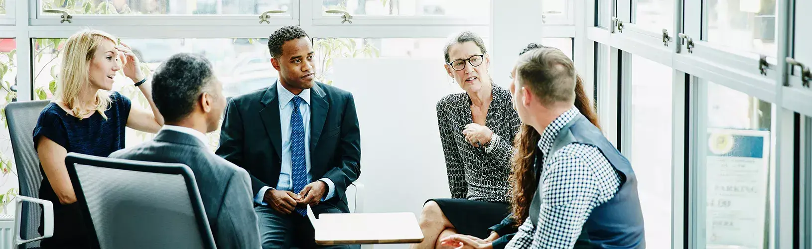 People discussing Governance around a table