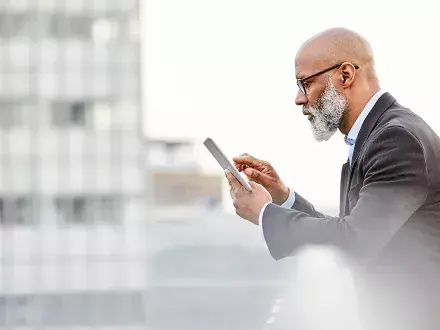 Sustainability professional checking his organization's ESG scores and ratings.